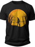 Men's Black Graphic T-Shirt with Orange Moon & Silhouette Design - Mysterious Figure & Bare Trees Spooky Theme Tee Top